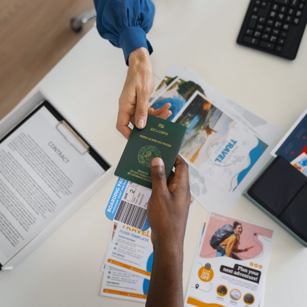 top-view-hands-holding-travel-documents top-view-hands-holding-travel-documents